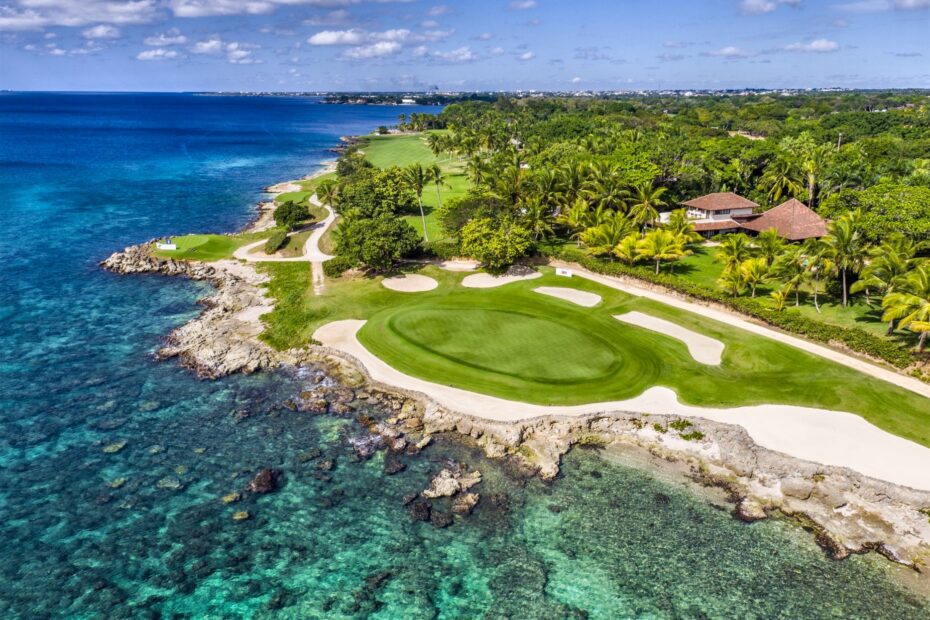 Aerial view of a Teeth of the Dog green on the Caribbean shore, the golf a package price comparison often leaves out